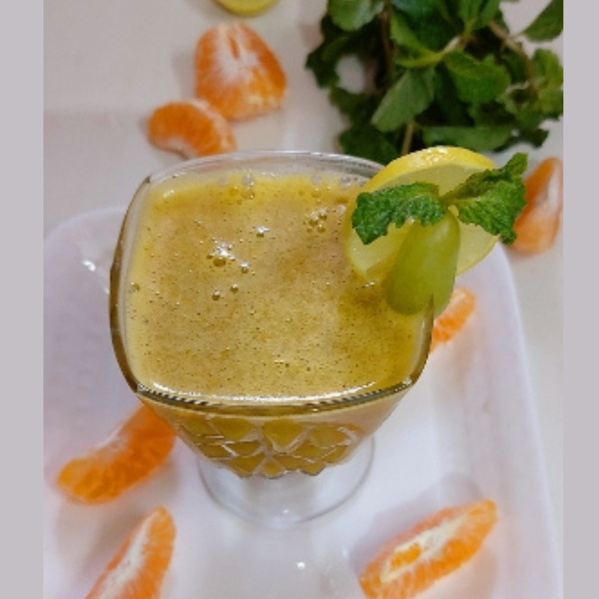 Orange Grape Juice With Fresh Turmeric Mint And Lemon / Vegan Drink